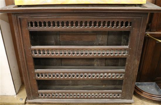 An 18th century French provincial walnut hanging wall shelves W.134cm